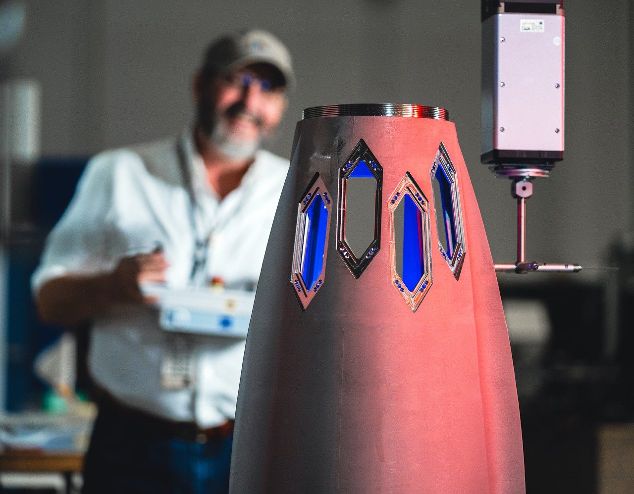 An additively produced Mako guidance section under inspection. Producing these parts using additive manufacturing delivers significant time and cost savings.